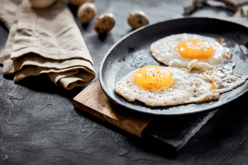 sunny side up eggs served on a plate