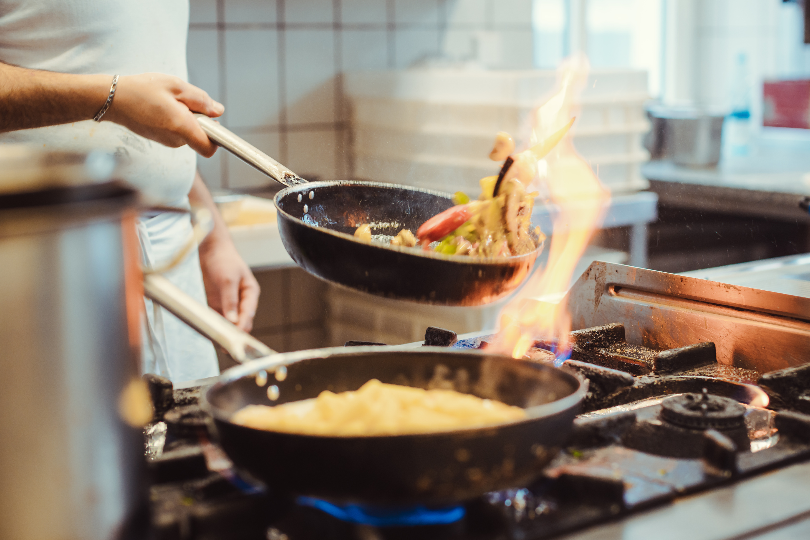 Restaurant Staff cooking on a gas stove